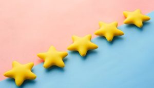 Picture showing yellow stars on a pink and blue background